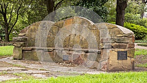 Stone bench constructed by the New Deal Works Progress Administration in the 1930`s in Turtle Creek Park, Dallas, Texas.