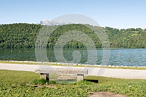 Stone bench at Levico Lake ,Dolomiti, Italy