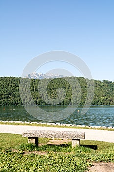 Stone bench at Levico Lake ,Dolomiti, Italy