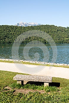 Stone bench at Levico Lake ,Dolomiti, Italy