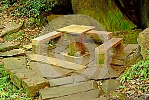 Stone bench and stone table photo