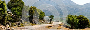 Stone block at the turn of a mountain road