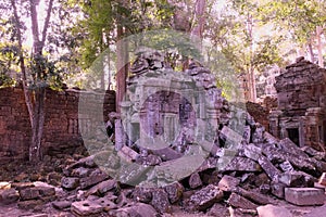 The stone blocks of the collapsed ancient building. Abandoned Khmer buildings in the forest. The ruins of ancient civilizations