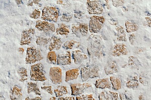 Stone blocks covered with snow