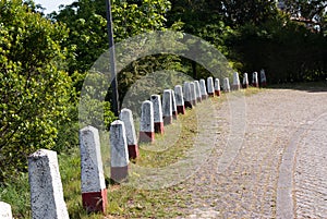 Stone bollards guardrail. Anciant guard rail photo