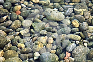 Stone bottom under clear water
