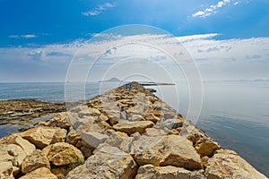 Stone breakwater on the Mediterranean coast of La Manga del Mar Menor photo