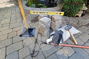 Stone Brick Pavers with Garden Tools photo