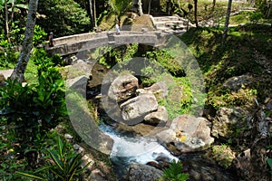 Stone bridge across river at Ganung Kawi Temple photo