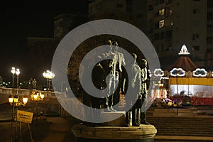 Stone Bridge and Boatmen of Thessaloniki Statue at night