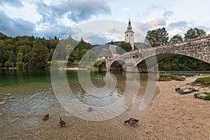 Stone bridge and church in the village of Ribchev Laz near the l