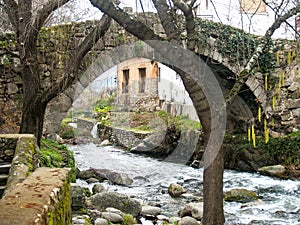 Stone bridge on Jewish neighborhood in Hervas, Spain photo