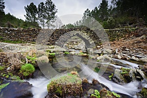 Stone bridge known as Males Bridge in Ovejuela Las Hurdes, Extremadura photo