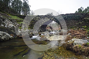 Stone bridge known as Males Bridge in Ovejuela Las Hurdes, Extremadura photo