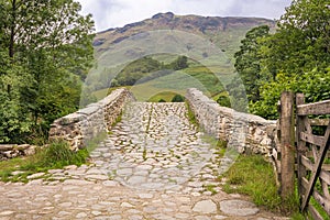 Stone bridge into the mountains