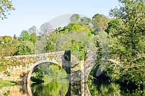 stone bridge over the Arnoia river in the medieval village of Allariz, Galicia. Spain photo