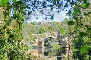 Medieval stone bridge over the Arnoia river in the village of Allariz, Galicia. Spain photo