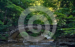 Stone bridge over a stream in Stony Brook State Park photo