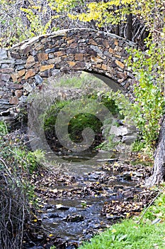 Stone bridge over the stream in the town of Patones de Arriba. Spain photo