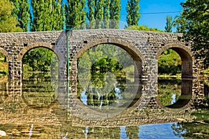 Stone bridge over Zrmanja river photo