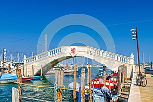 Stone bridge Ponte di Vigo across Vena water canal in historical centre of Chioggia photo