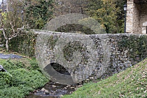 Stone bridge on the river photo