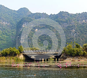 Stone bridge on the river in Tam Coc