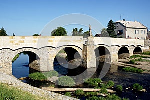 Stone bridge with the statue of St. John of Nepomuk in Litovel photo