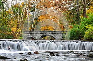 Stone Bridge And Waterfall