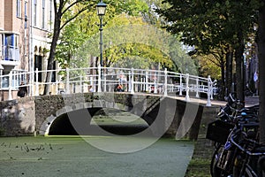 A stone bridge with white railings