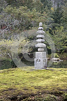 Stone buddha at carvings are inside the garden of Kinkakuji Temple Kyoto