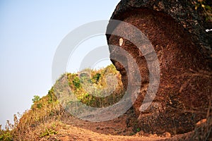 Stone Buddha Head at the mountain near Gokarna photo