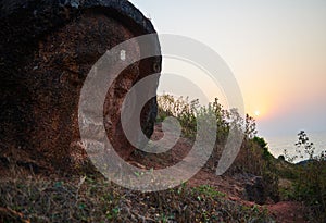 Stone Buddha Head at the mountain near Gokarna photo