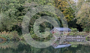 Stone building, on a lake shore in the forest
