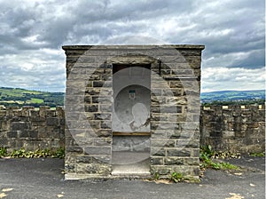 Stone built bus stop, on Red Lees Road, Cliviger, Burnley, Lancashire