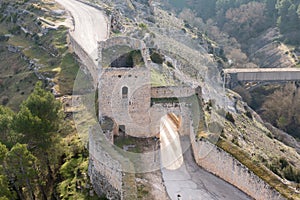 Stone-built, gated entrance in the historic city walls of Alarcon, Spain photo