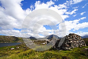 Stone built sheepfold and landscape photo