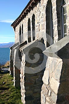 Stone buttresses of rustic building in countryside