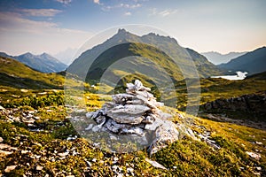 Stone cairn with Giglachsee lake behind