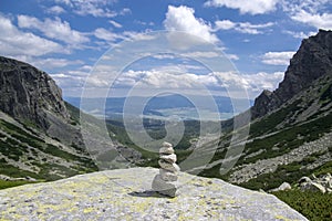 Stone cairn pyramid, valley in High Tatras, Mlynska Dolina, wild slovakia mountains