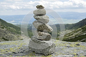 Stone cairn pyramid, valley in High Tatras, Mlynska Dolina, wild slovakia mountains