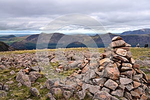 Stone Cairn and sheep on Caw Fell