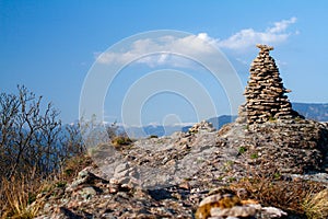 Stone Cairn in South Tyrol above Bolzano. Nice Sunny day in SÃÂ¼dtirol on a Mountain photo