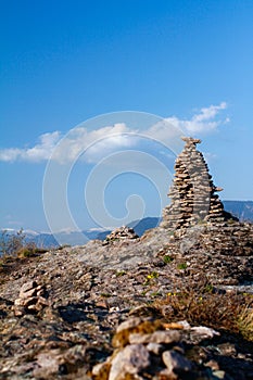 Stone Cairn in South Tyrol above Bolzano. Nice Sunny day in SÃÂ¼dtirol on a Mountain photo