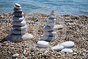 Stone cairns on the beach. Kolimpia, Rhodes, Greece