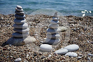 Stone cairns on the beach. Kolimpia, Rhodes, Greece