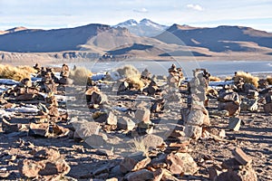 Stone cairns on a mountain top overlooking Laguna Morejon in the Sud Lipez province, Eduardo Avaroa Reserve, Bolivia