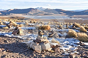 Stone cairns on a mountain top overlooking Laguna Morejon in the Sud Lipez province, Eduardo Avaroa Reserve, Bolivia