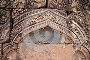 Stone carved bas-relief of Banteay Srei temple in Angkor Wat, Cambodia. Decorative bas-relief on cambodian hindu temple.