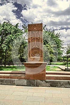 Stone carved cross on the territory of the Church